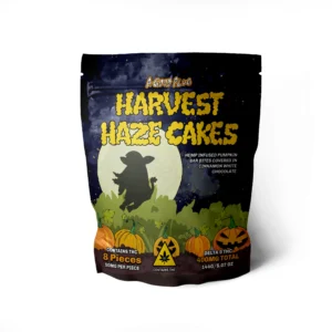 AGoodPlug's Harvest Haze Cakes packaging, displaying the shadow of a cow on a full moon as the background for a jack-o-lantern pumpkin patch.