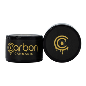 Two Carbon branded black jars. One upright and the other showing the top next to it.